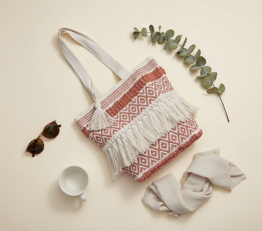 Model carrying Woven Earth Crimson Weave tote bag — boho style